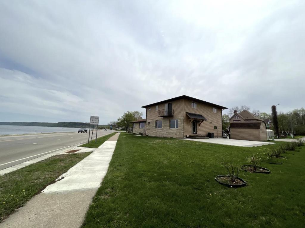 a house on the side of a road with bikes on the grass at 600 Lakeshore home in Lake City