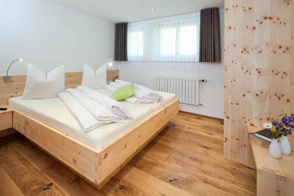 Postel nebo postele na pokoji v ubytování Aparthotel Brunnenhof