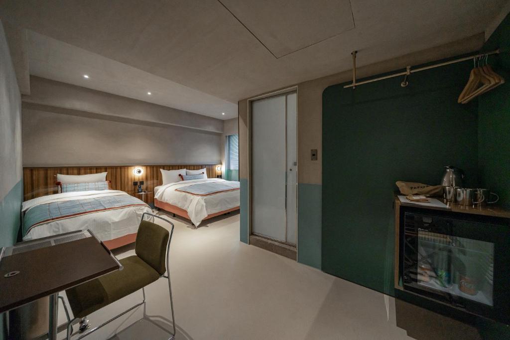 Postel nebo postele na pokoji v ubytování PAPO'A Labs