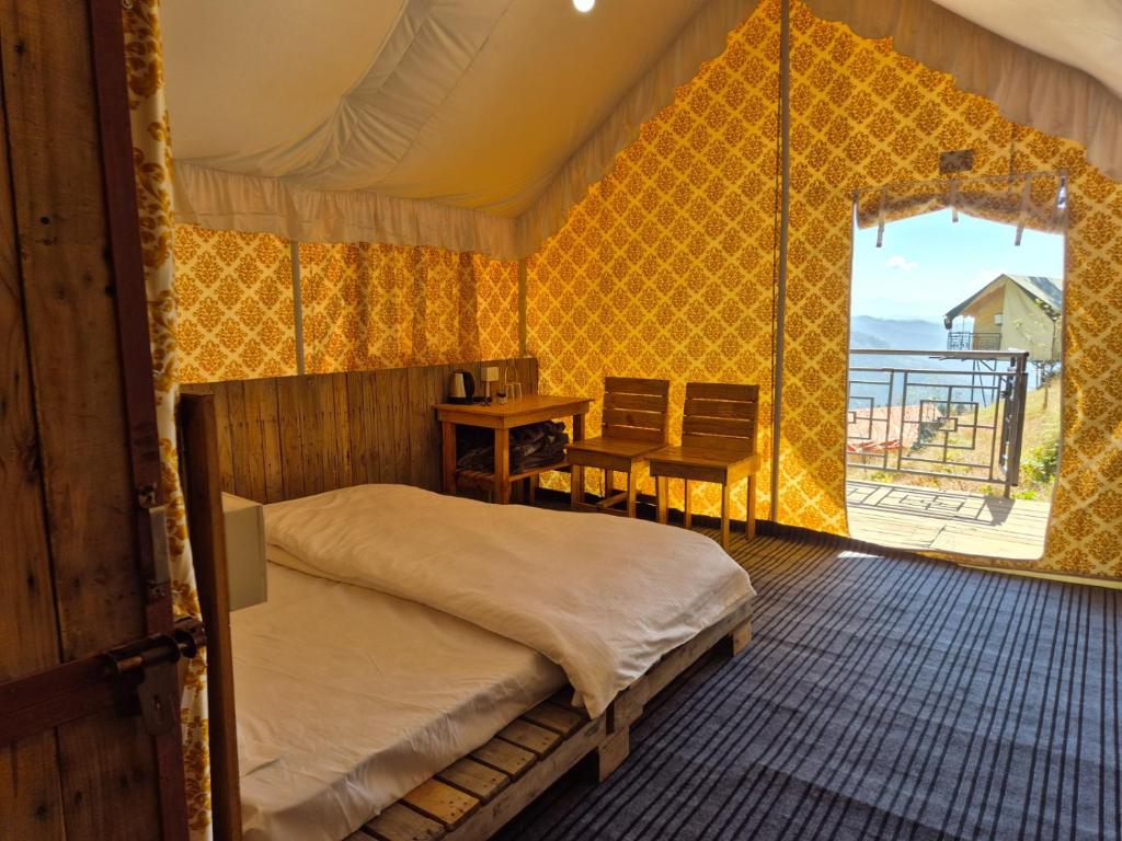 Ένα ή περισσότερα κρεβάτια σε δωμάτιο στο Arc 305 Degree Nature Camp