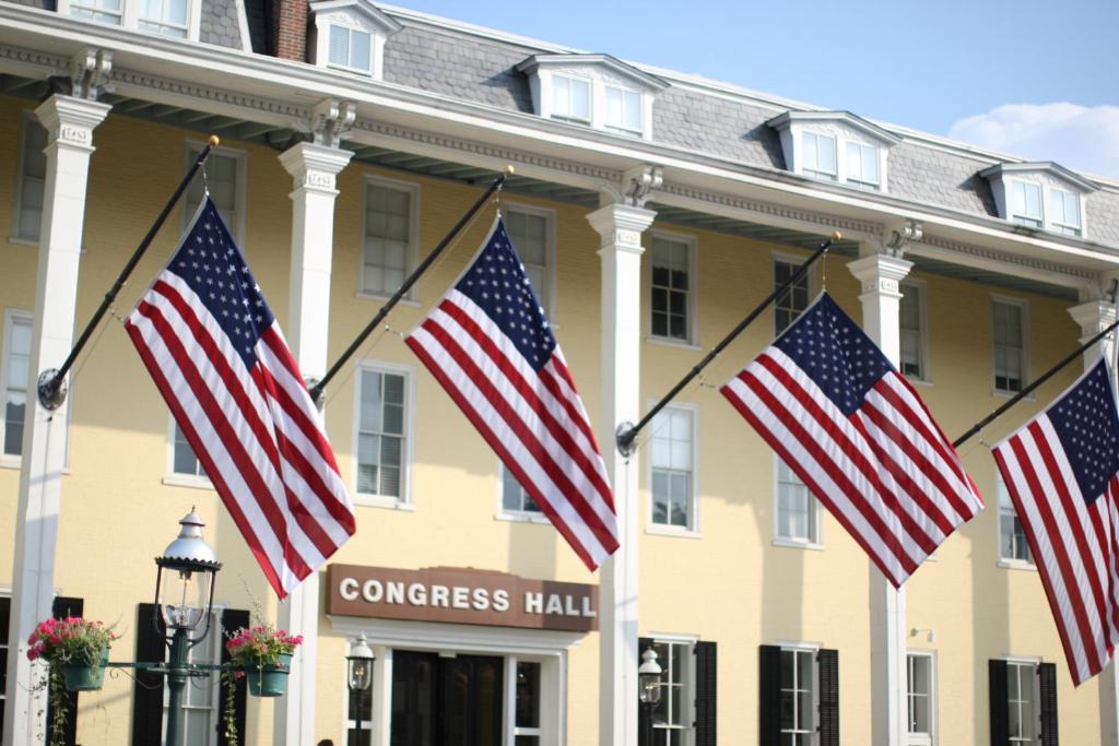 a row of american flags in front of a congress hall at Congress Hall in Cape May