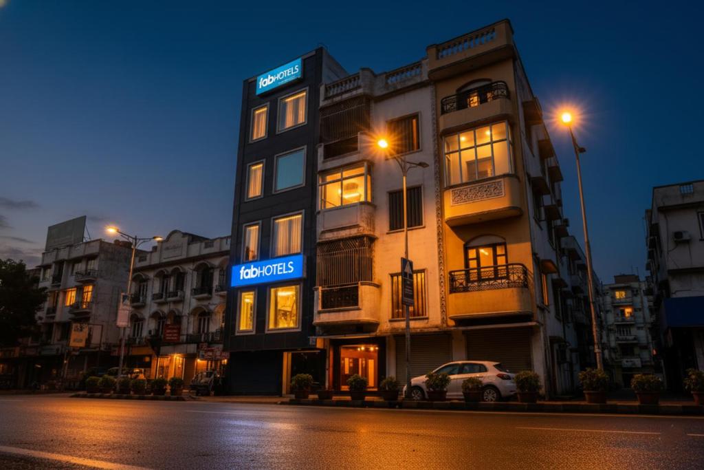 a building with a sign on the side of a street at FabHotel A 97 in New Delhi