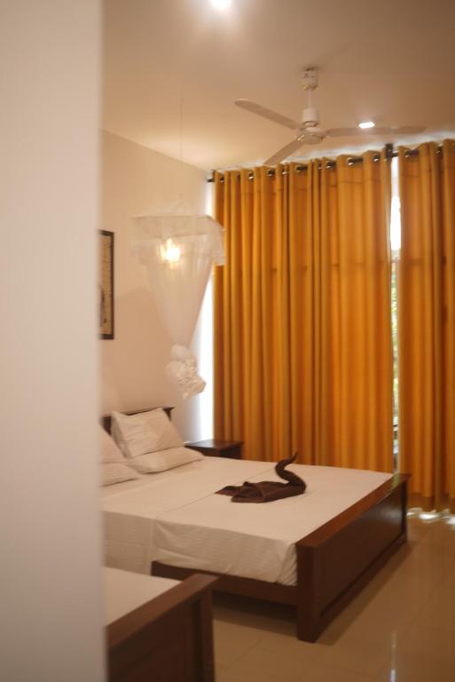 Кровать или кровати в номере Walaw watta resort