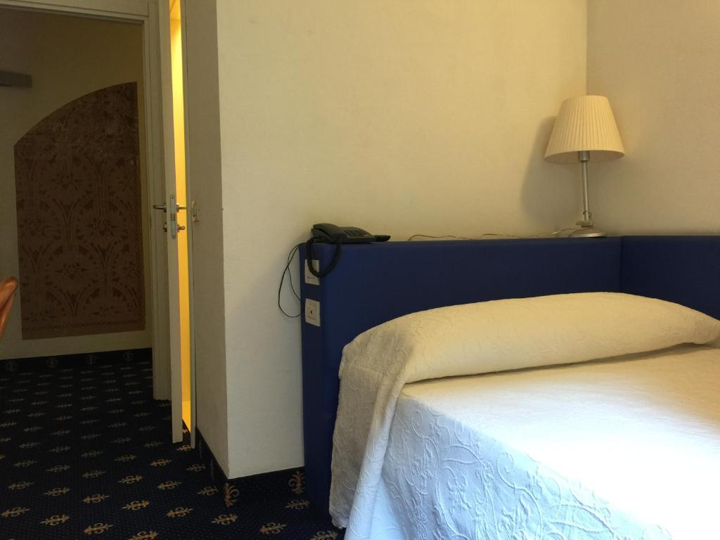 Postel nebo postele na pokoji v ubytování My Hotel Milano