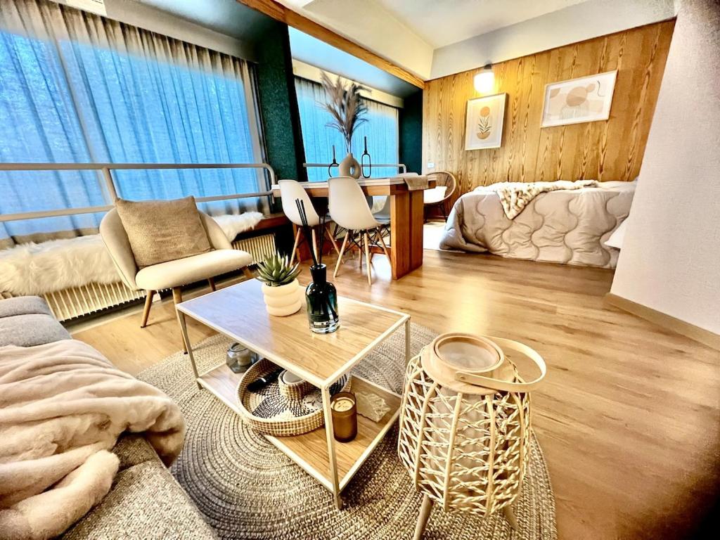 a living room with a couch and a table at Suite Albare, Marilleva 1400, Val di Sole in Marilleva