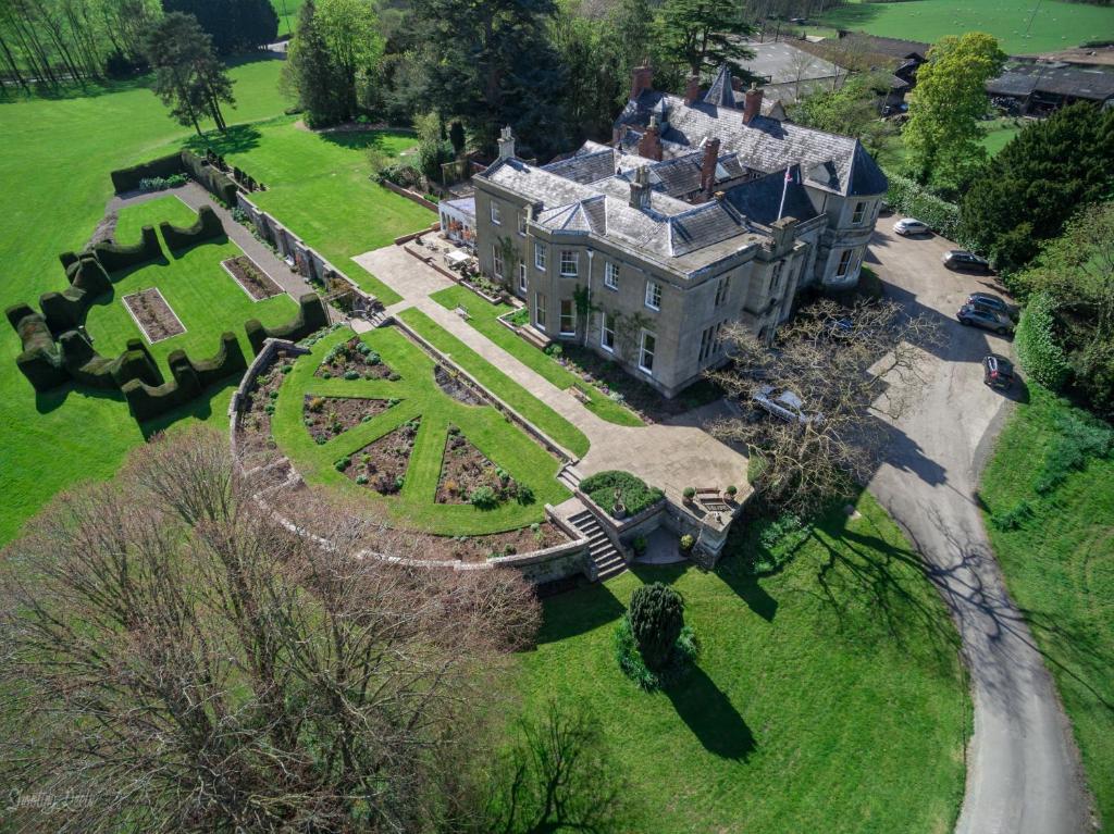 an aerial view of a large house with a garden at Burton Court in Dilwyn