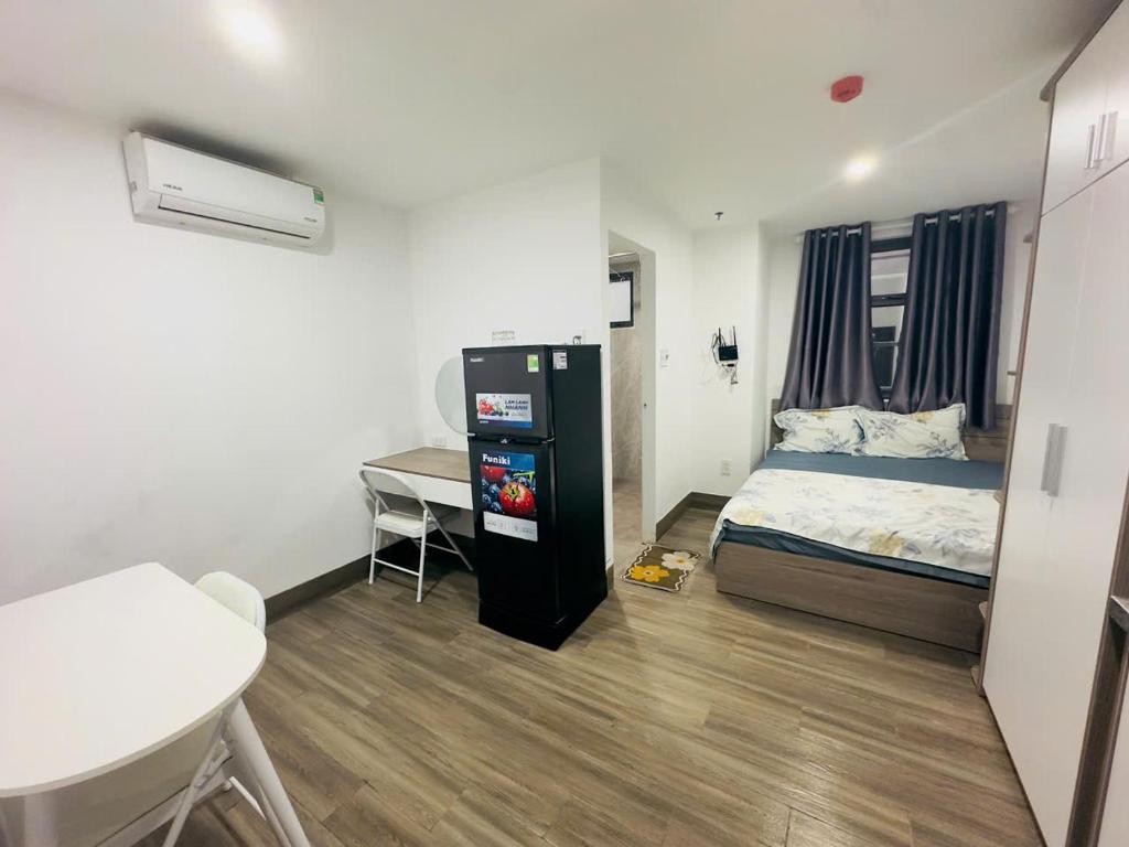 Postel nebo postele na pokoji v ubytování Thiên Khánh Apartment