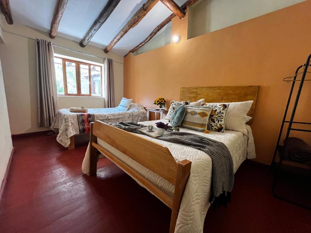 Postel nebo postele na pokoji v ubytování Casa Paqocha Garden - Ollantaytambo - Hot Water - Wifi - Cocina Compartida