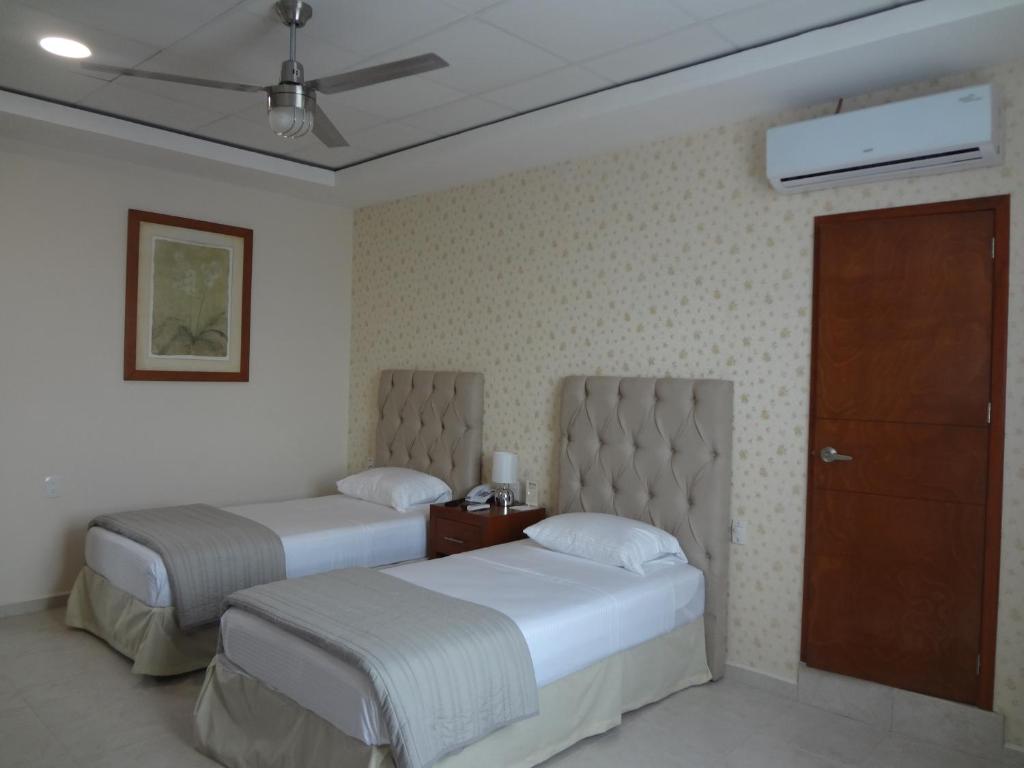 Postel nebo postele na pokoji v ubytování Hotel Civic Express
