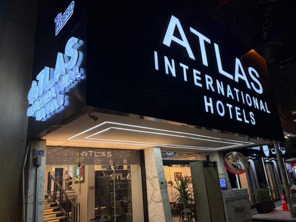 a sign for an atlas international hotel on a building at Atlas Hotels in Cairo
