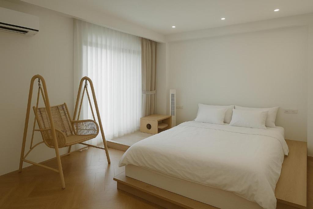 Postel nebo postele na pokoji v ubytování 冬山好朋友家 D-ong S-han good friend B&B