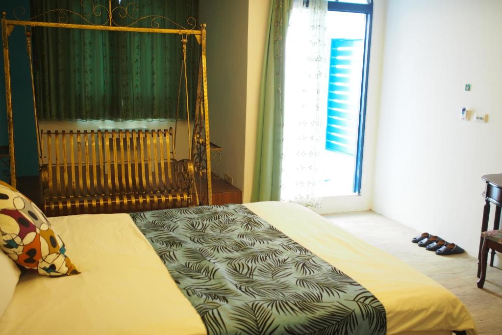 Postel nebo postele na pokoji v ubytování Shengtuolini B&B