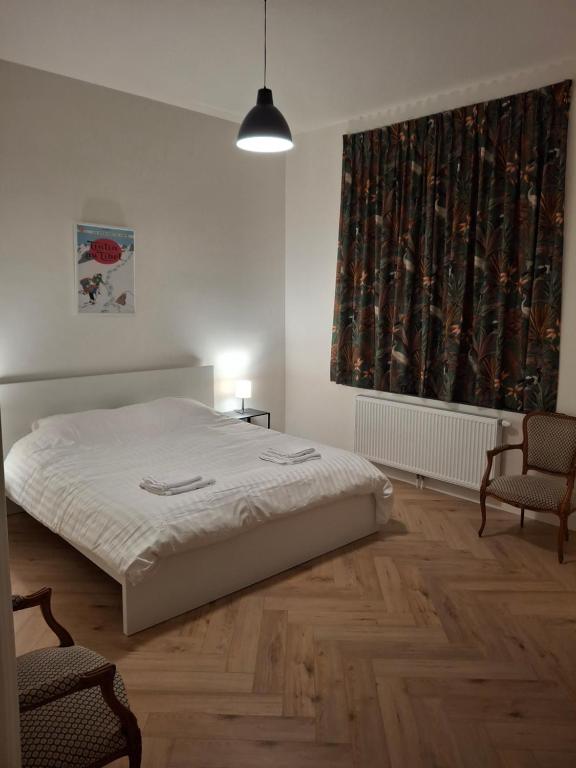 Postel nebo postele na pokoji v ubytování Villa Froidvau