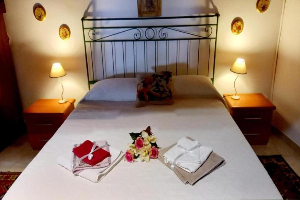 Postel nebo postele na pokoji v ubytování La Dimora del 1700