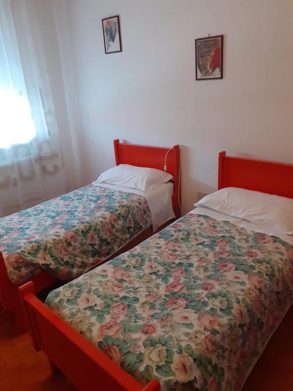 Postel nebo postele na pokoji v ubytování Locanda da Lucia