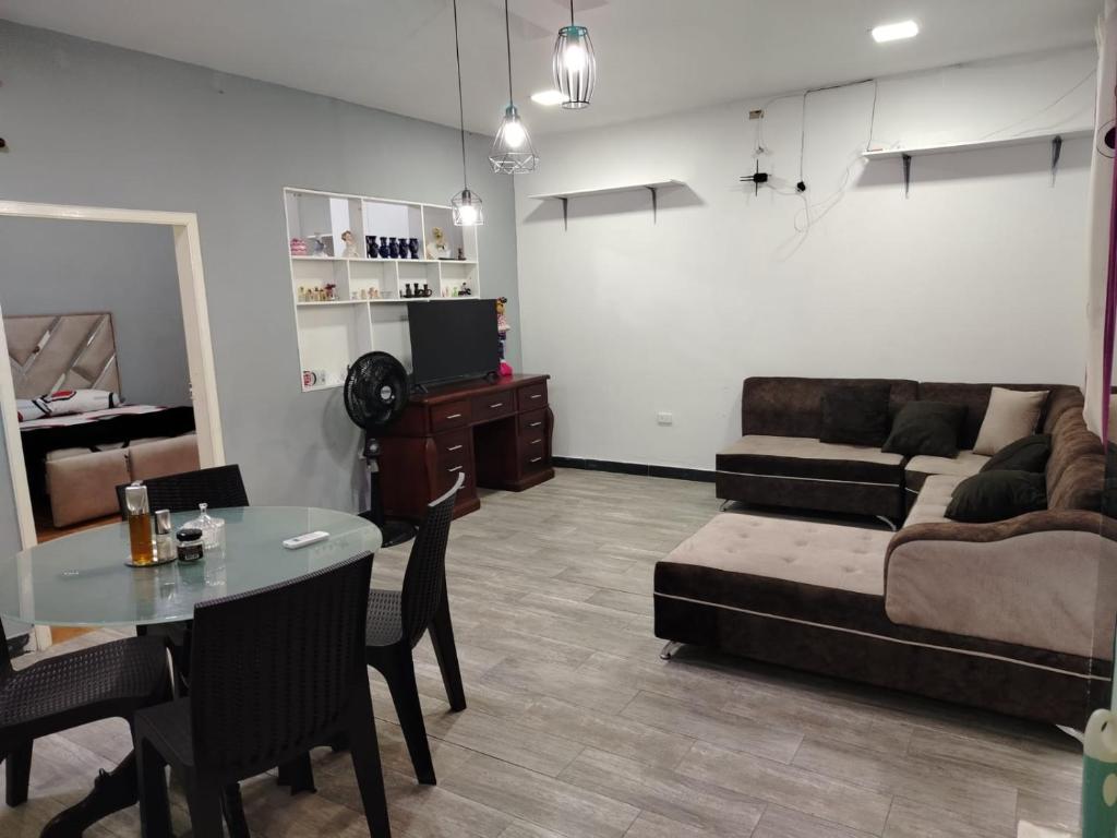 a living room with a couch and a table at lago dreams in Lago Agrio