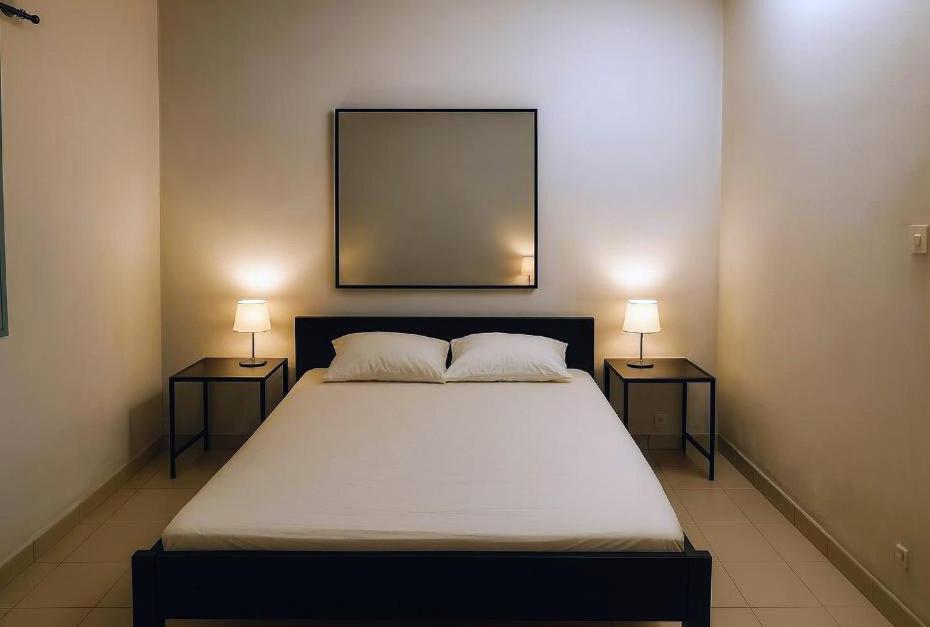 Postel nebo postele na pokoji v ubytování La Petite Maison