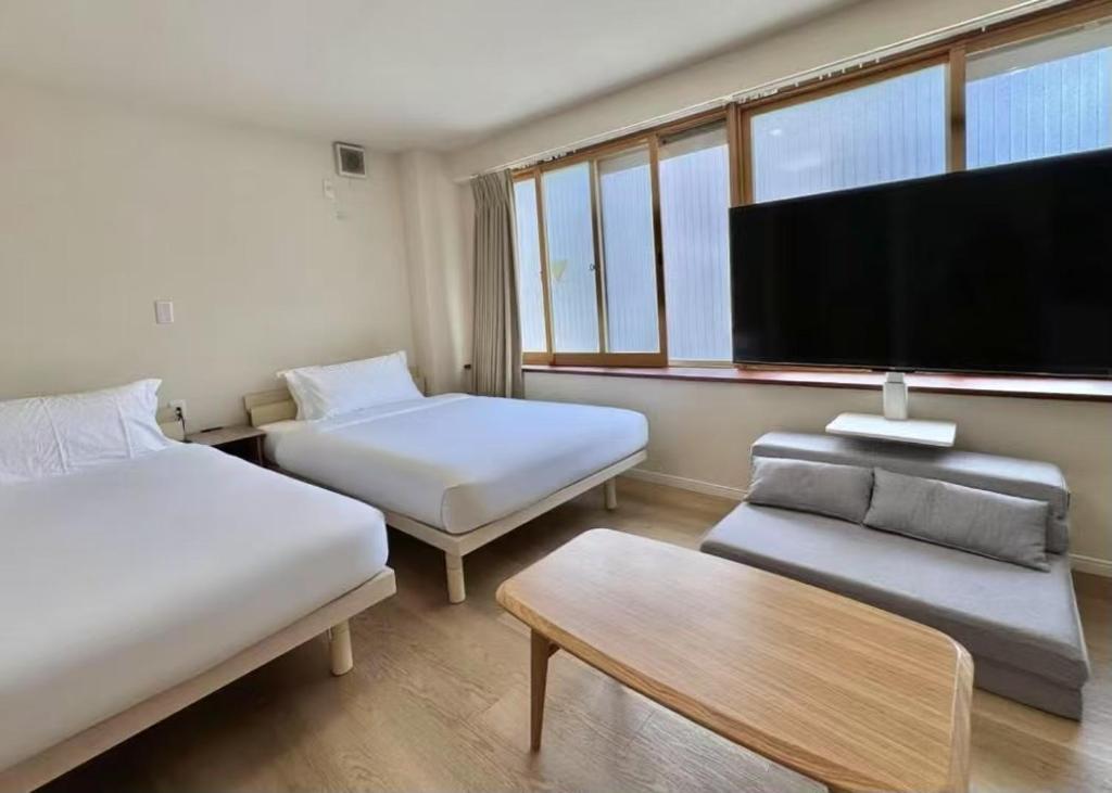 Postel nebo postele na pokoji v ubytování Ikeda Ueno 301 Twin Room