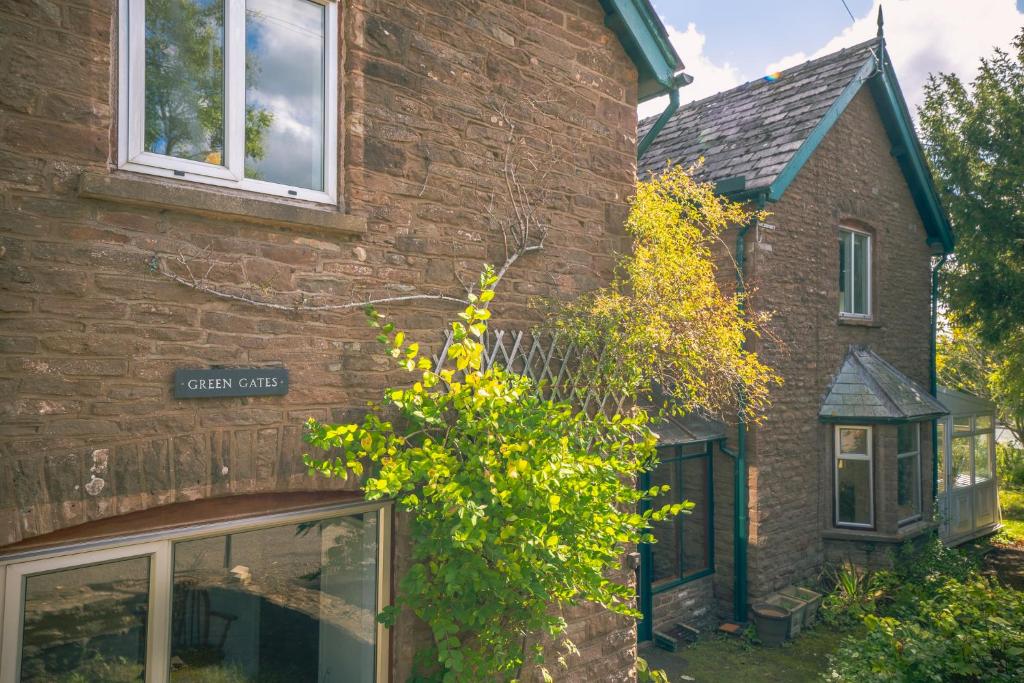 a brick house with a window on the side of it at Greengates Nature Filled Countryside Escape 