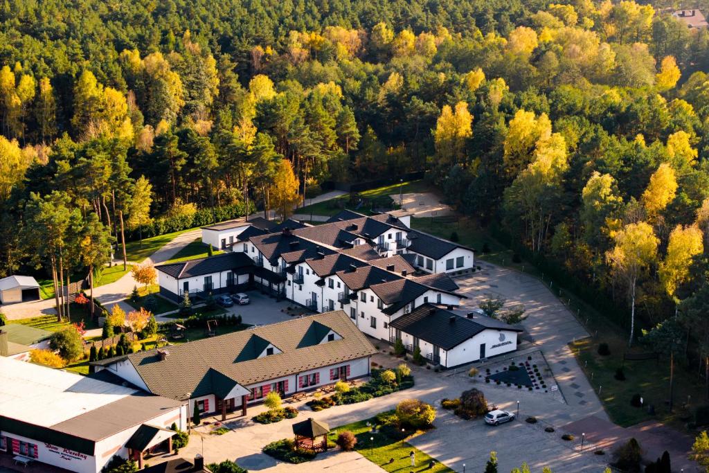 an aerial view of a resort with a large building at Jurajski Kryształ in Zaborze