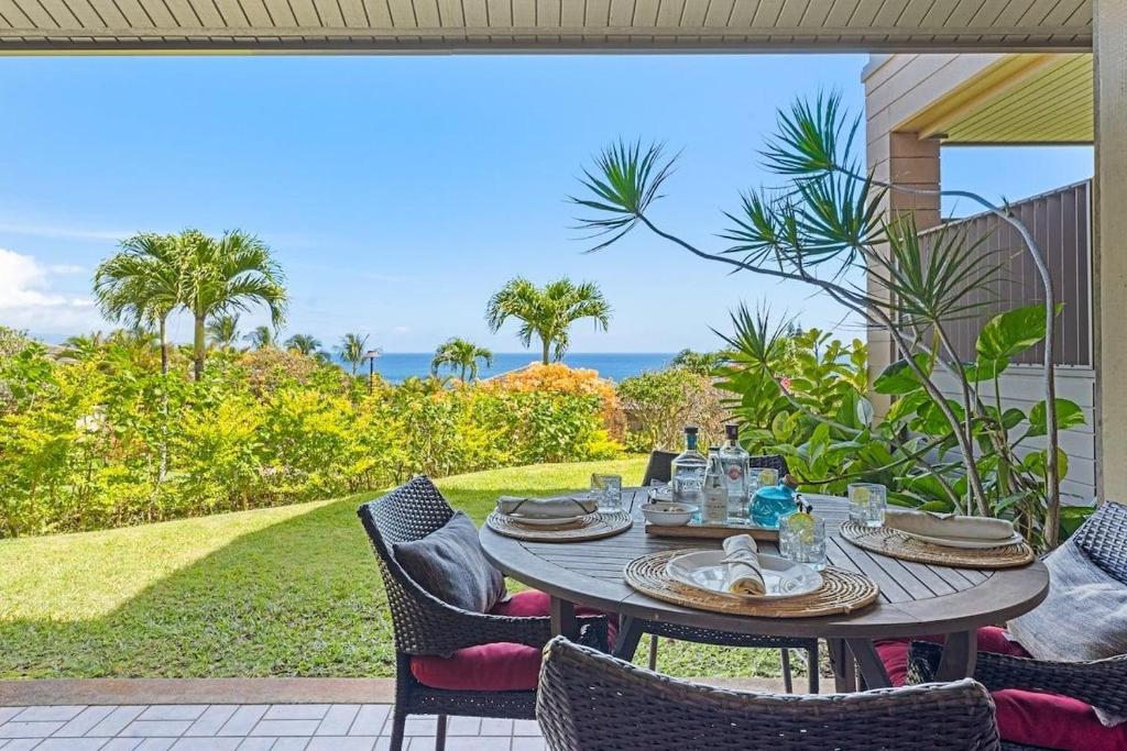 a table on a patio with a view of the ocean at Kapalua Ridge Villas 311 · KRV 311 Beautiful Kapalua Villa for W in Kahana