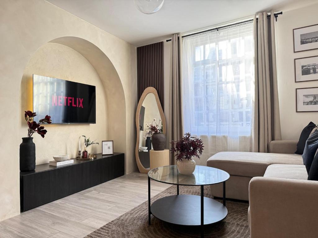 a living room with a couch and a table at New Modern 2 Bedroom Central Apt Greater Manchester, Sleeps 5, Near Airport with Great Transport Links in Stockport