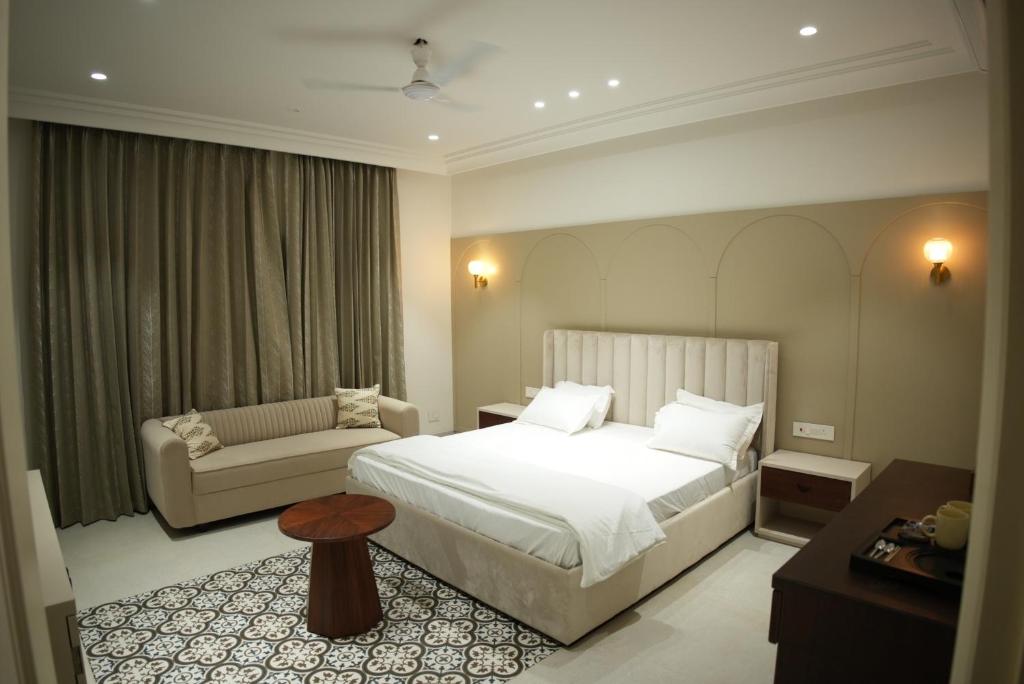 Postel nebo postele na pokoji v ubytování Kaayanaat Villa