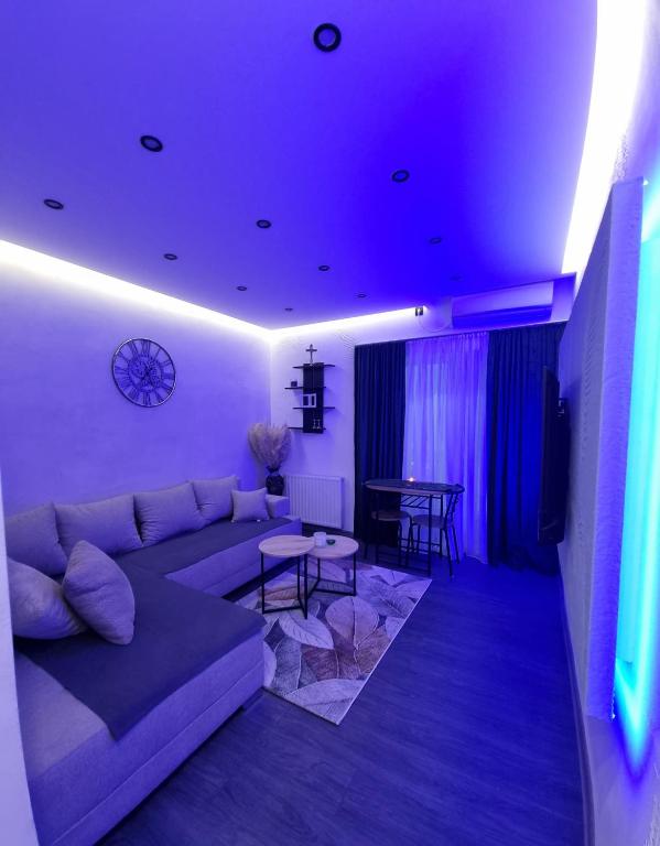 a living room with a couch and a table at CARPE DIEM Unique S&P in Valjevo