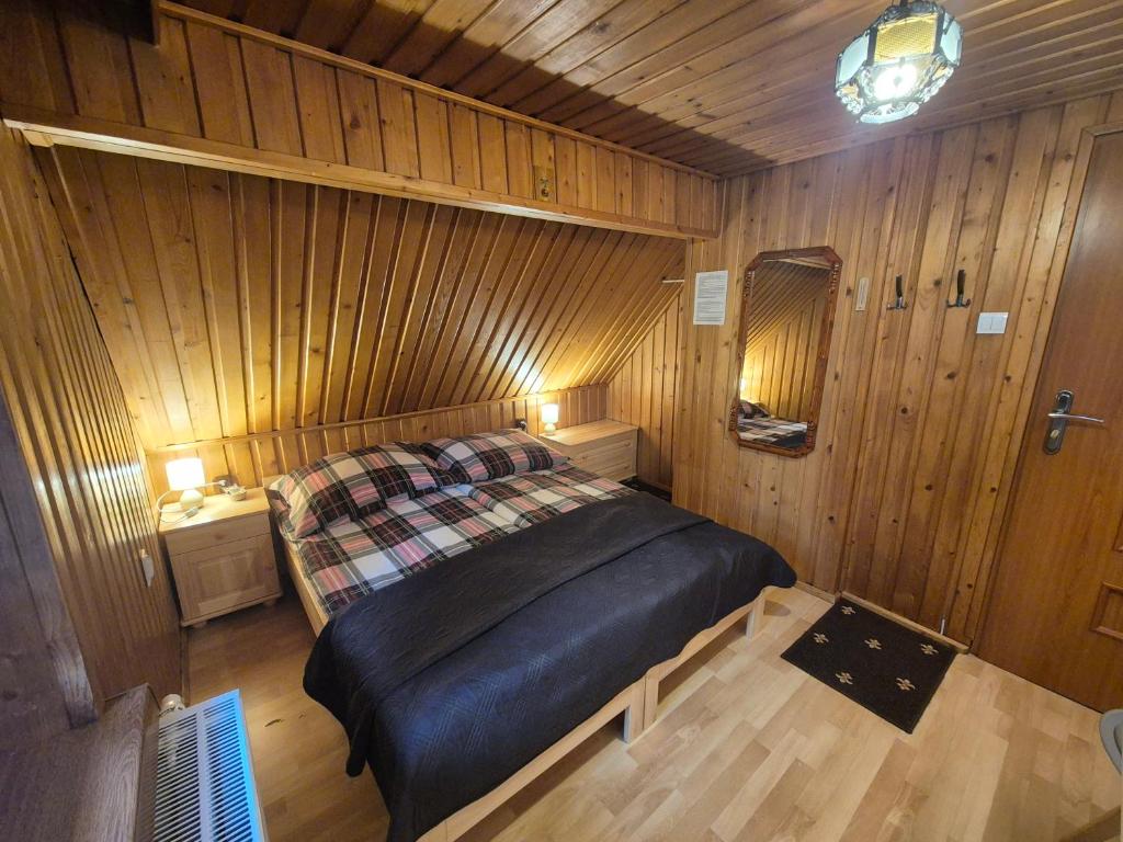 Una cama o camas en una habitación de Wynajem Pokoi Gościnnych