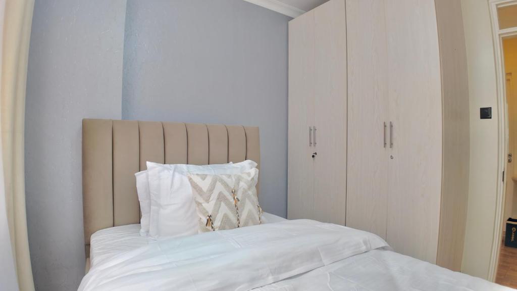 Ένα ή περισσότερα κρεβάτια σε δωμάτιο στο Paz Home's Kiambu Road