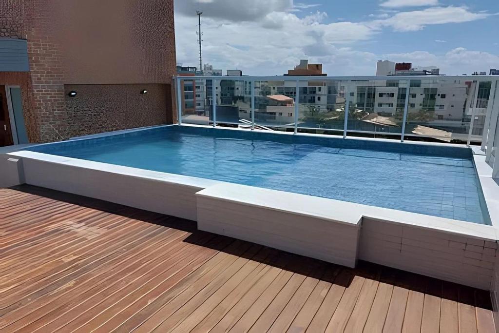 a large swimming pool on the roof of a building at Flat 201 Paradise in João Pessoa