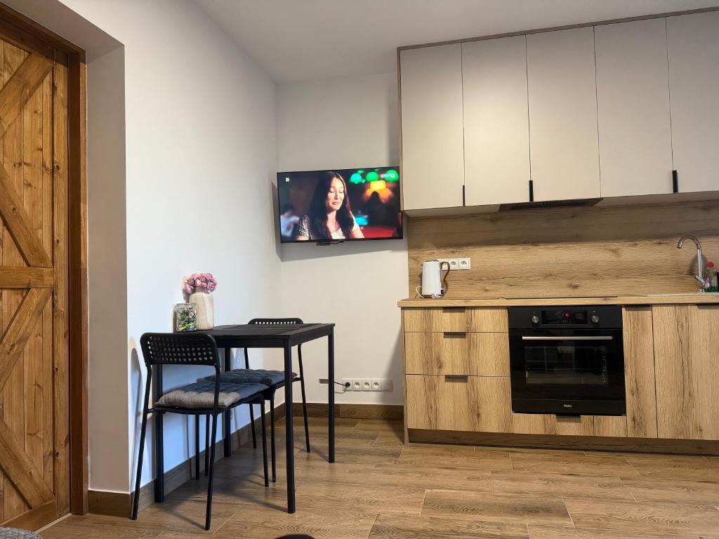 Η κουζίνα ή μικρή κουζίνα στο Apartament przy sadzie