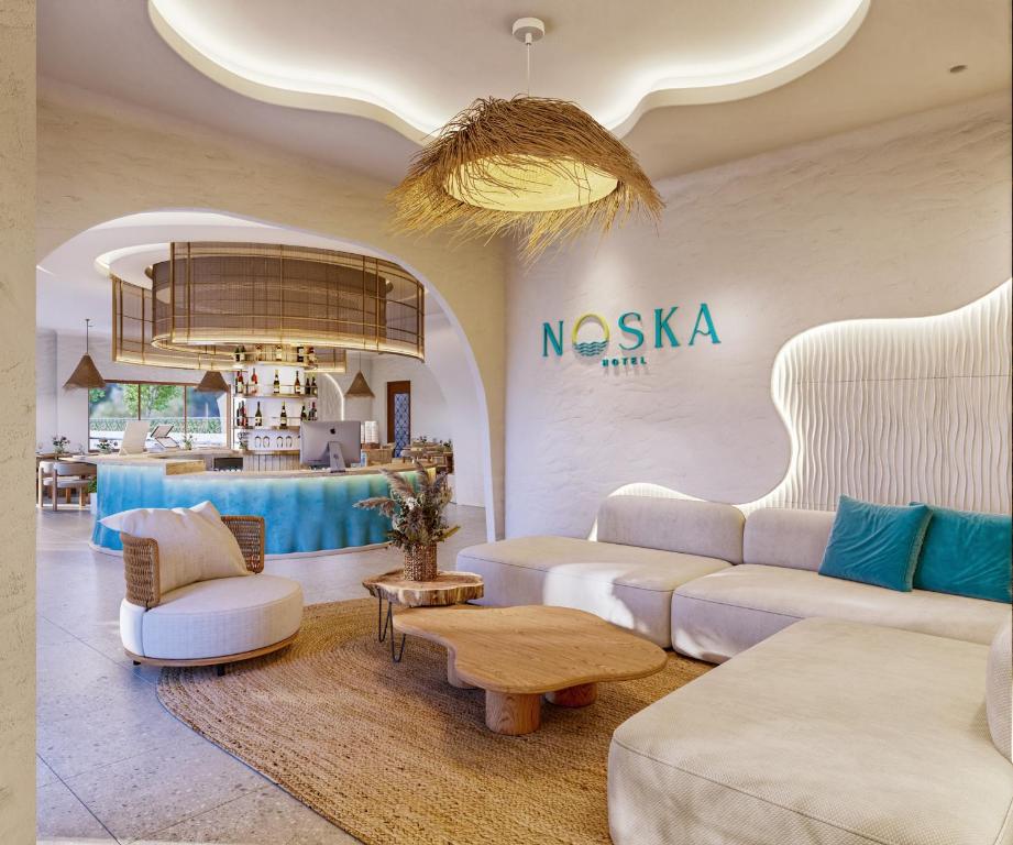 a living room with a couch and a table at Noska Hotel in Phu Quoc
