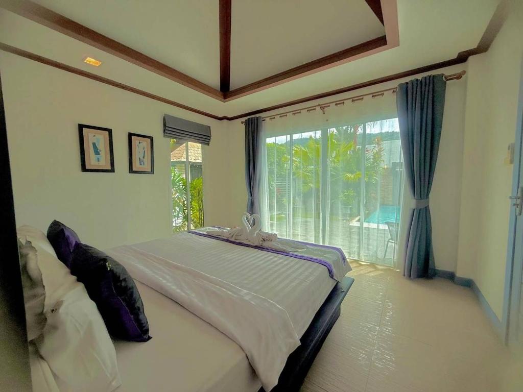 Ένα ή περισσότερα κρεβάτια σε δωμάτιο στο Suriyasom Villa 5