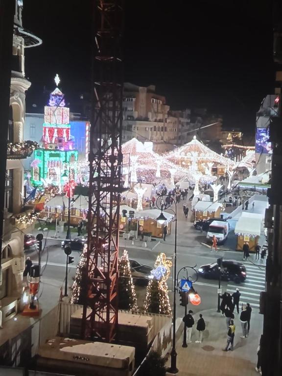 a city lit up at night with christmas lights at Crăciun în Centrul Craiovei in Craiova