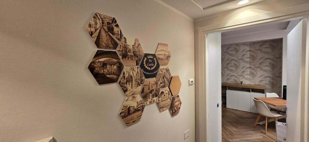 a collage of photographs on the wall of a room at Re Carlo - Appartamento Filomena in Perugia