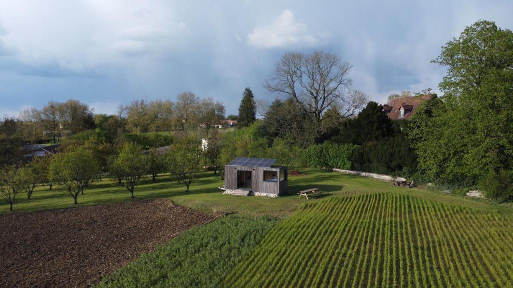 an aerial view of a field with a small house at Parcel Tiny House Vallée, près de Verdun in Rarécourt