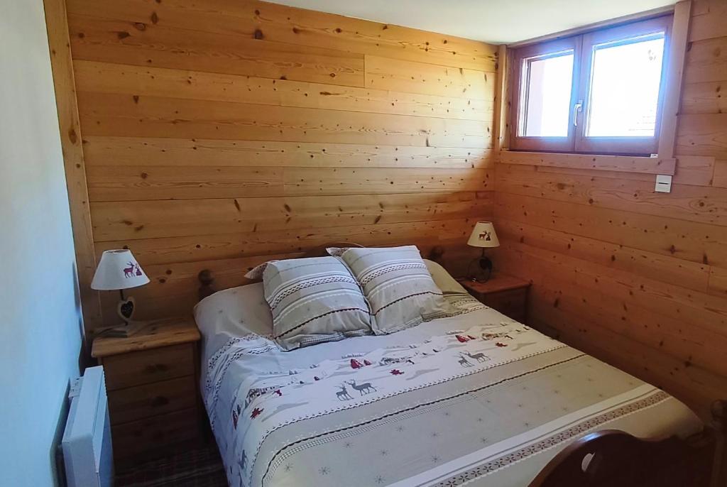 Postel nebo postele na pokoji v ubytování Appartement de la Fruitière