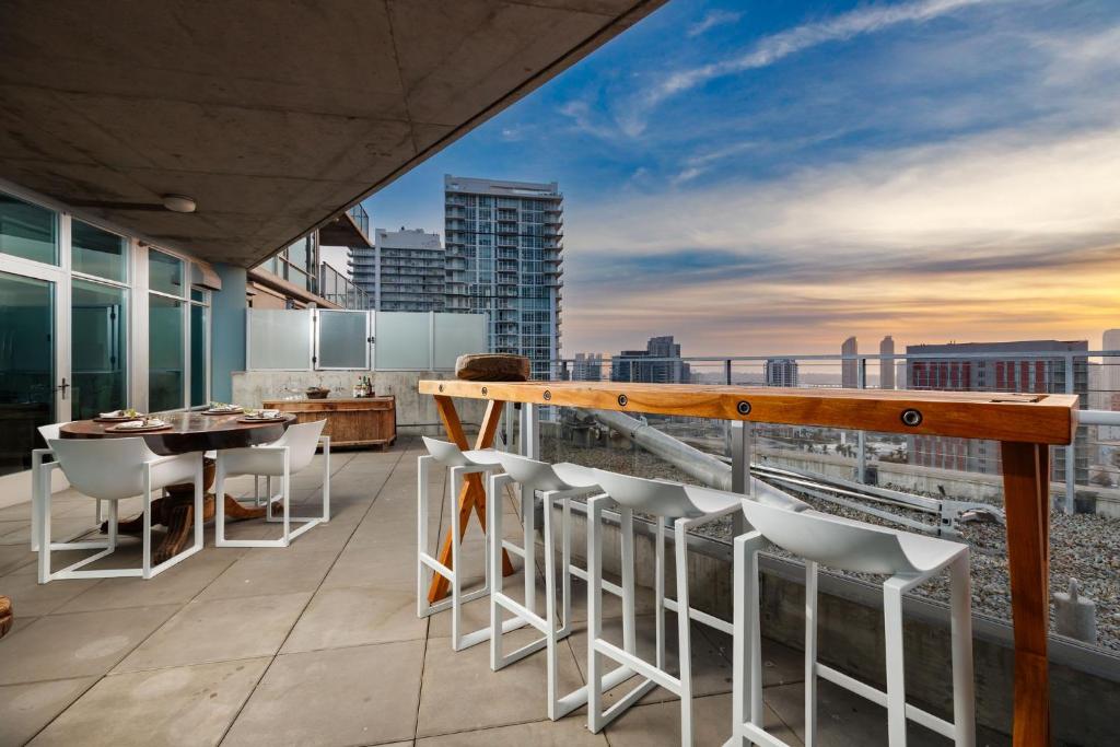 a balcony with a table and chairs on a building at The Gallery Loft - Downtown finest in San Diego