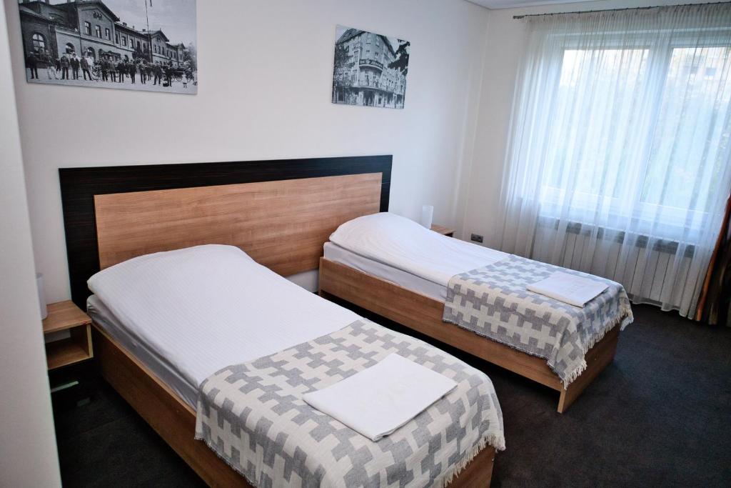 En eller flere senge i et værelse på Restauracja Stylowa