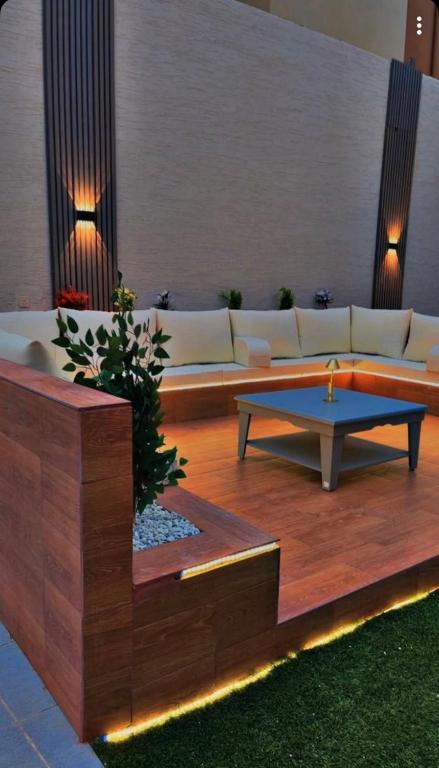 a living room with a couch and a coffee table at شاليهات سمو بارك 1 in Taif