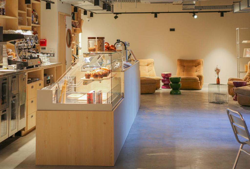 a room with a counter with some food on it at Mustard Hostel in Dijon