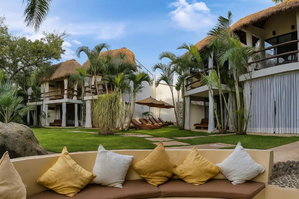 a couch sitting in front of a resort at Mocca Hotels in Tepoztlán