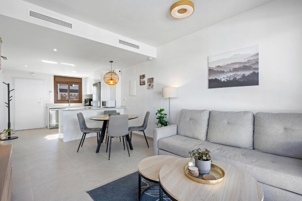 a living room with a couch and a table at Casa MardeSal in San Pedro del Pinatar