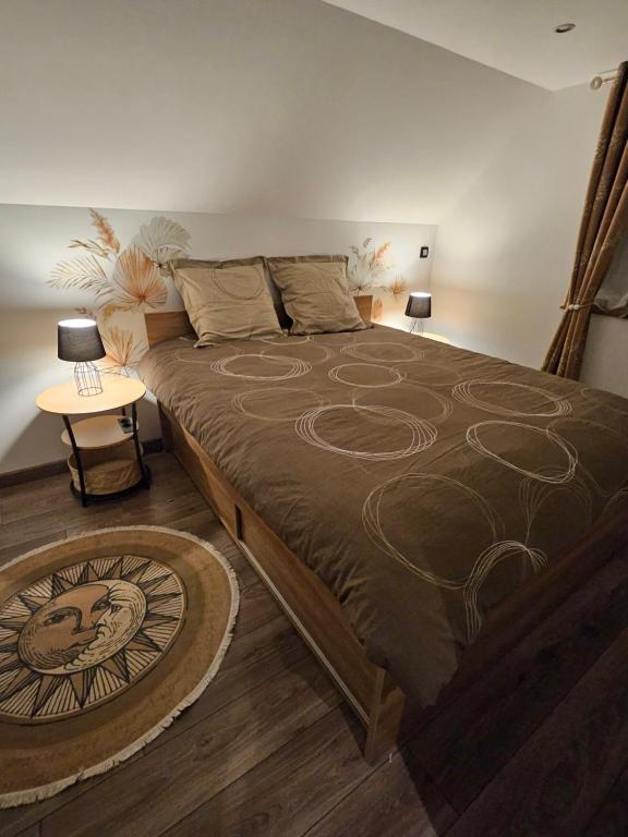 a bedroom with a large bed with at Gîte Vallée de Munster 3 étoiles chez Flavie & Ludo in Muhlbach-sur-Munster