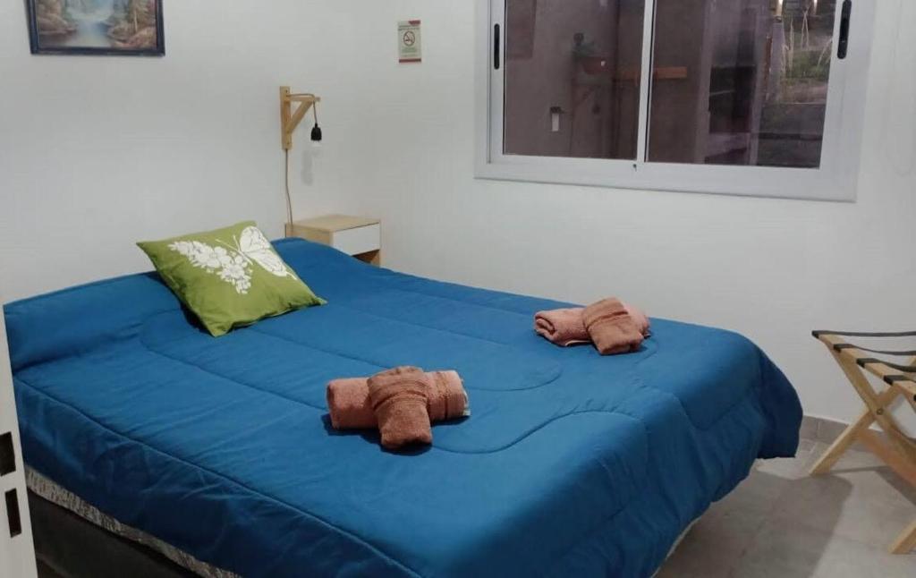 Postel nebo postele na pokoji v ubytování Casa Sawa Potrero de los Funes