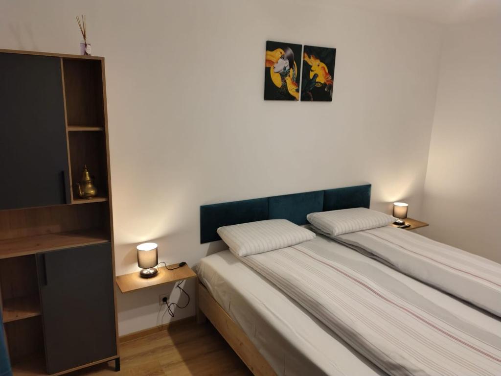 Postel nebo postele na pokoji v ubytování Green Studio Nord