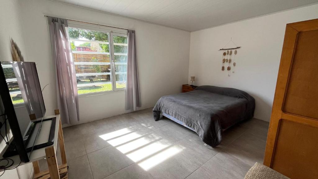 Postel nebo postele na pokoji v ubytování CASA PRANA Quequén