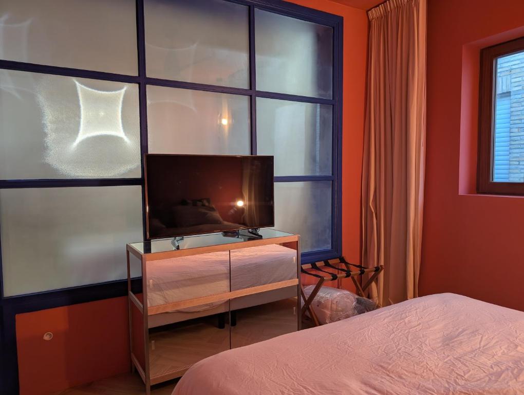 Ένα ή περισσότερα κρεβάτια σε δωμάτιο στο Geldmunt 37