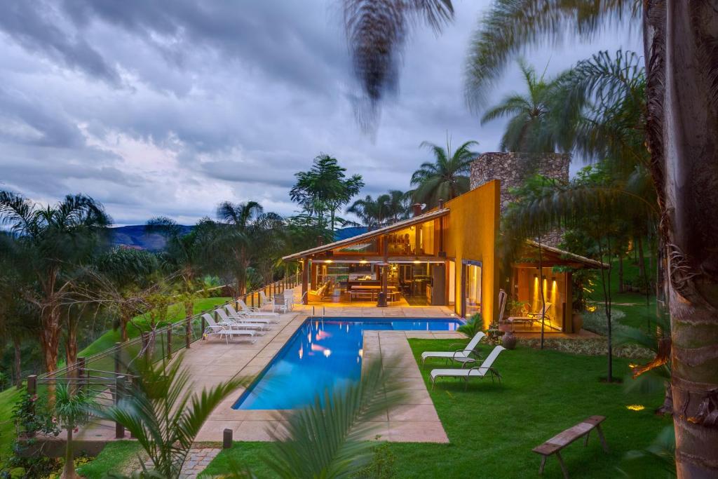 a house with a swimming pool in front of it at Departamento Paraiso in Eva Perón